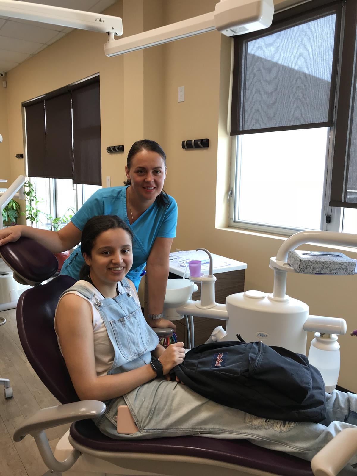 Brace Central office interior — patient with hygienist in treatment chair