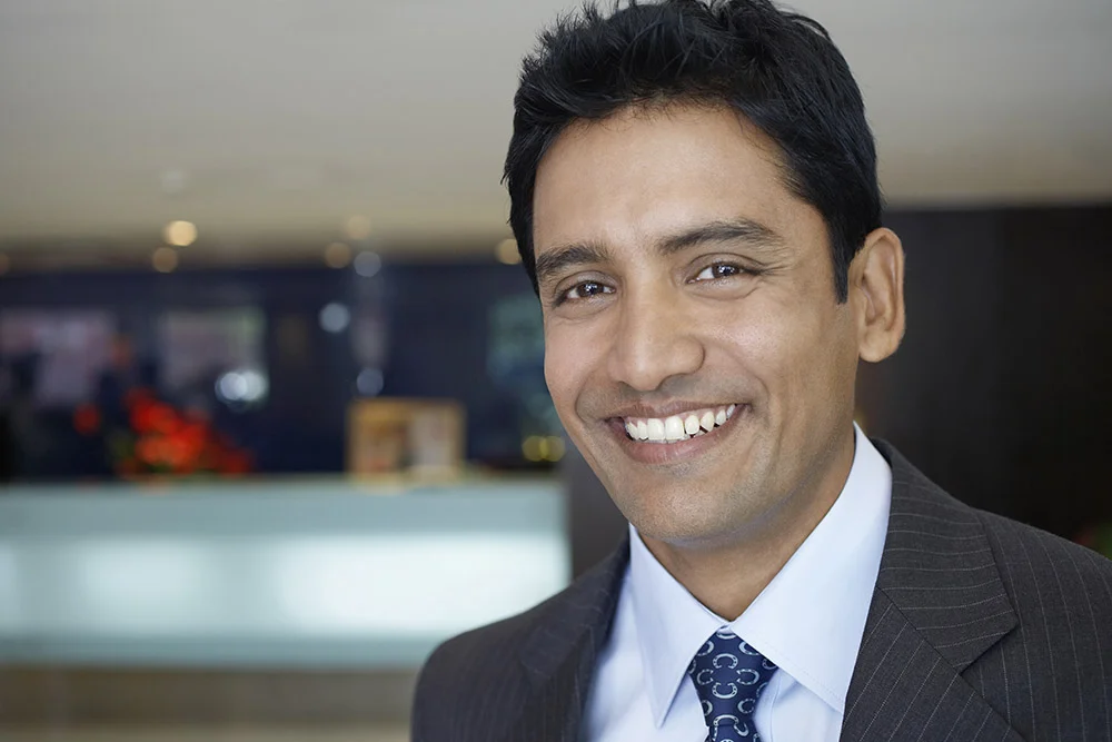 Businessman smiling with braces